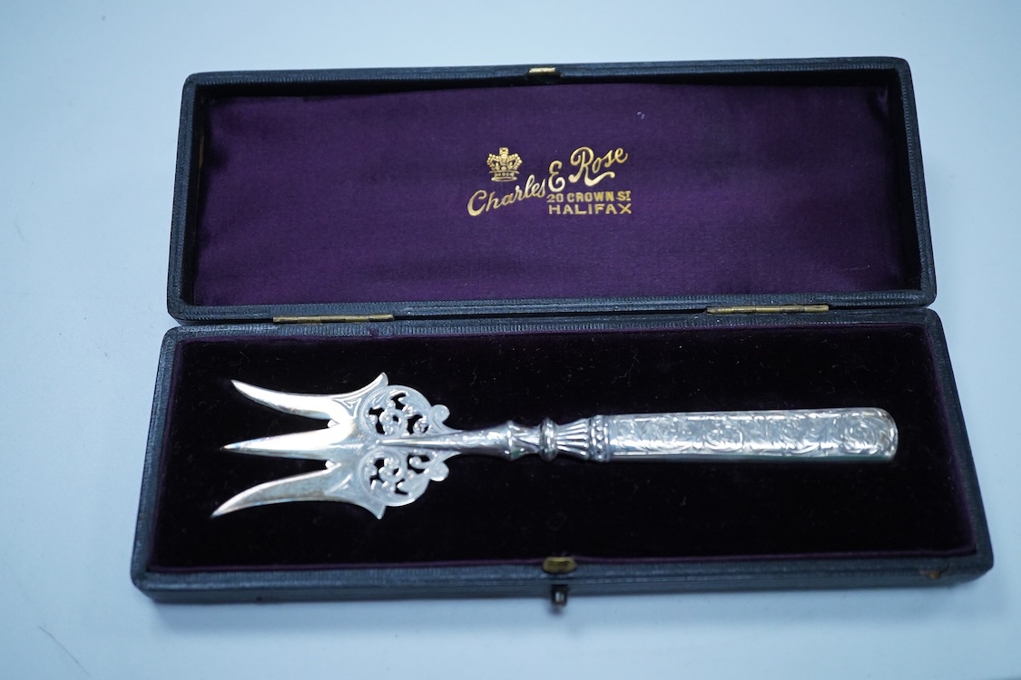 A collection of small silver to include a George V engraved concave card case, I. S. Greenberg & Co, Birmingham, 1912, 80mm, a cased late Victorian small bread fork, a modern mounted glass posy vase, an Irish nut dish, a